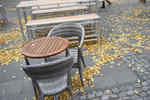 Leaves on footpath under tables in Wilmersdorfer Strasse, Charlottenburg, Berlin, Germany