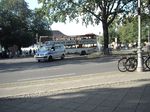 Polizei vehicle turns in busy road in front of queue for an event at Schloss Bellevue 